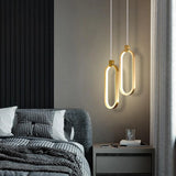Lámpara colgante ovalada LED dorada minimalista para mesita de noche