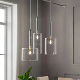 Lámpara colgante cilíndrica de vidrio moderna regulable en altura para comedor