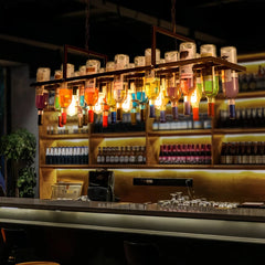 Lámpara colgante vintage con botellas de vidrio y altura regulable para comedor