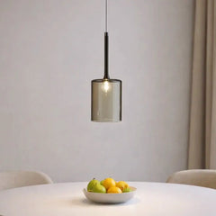 Lámpara colgante cilíndrica de vidrio moderna regulable en altura para comedor