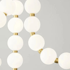 Lámpara colgante moderna y elegante con cadena de bolas blanca para salón