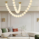 Lámpara colgante moderna y elegante con cadena de bolas blanca para salón
