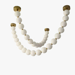 Lámpara colgante moderna y elegante con cadena de bolas blanca para salón