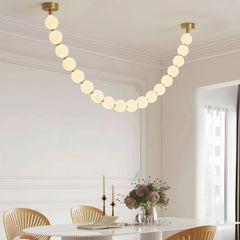 Lámpara colgante moderna y elegante con cadena de bolas blanca para salón