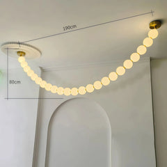 Lámpara colgante moderna y elegante con cadena de bolas blanca para salón