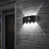Aplique de pared exterior bidireccional con sensor de movimiento, 8 LEDs y IP65