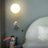 Apliques de pared dormitorio juvenil con forma de astronauta lunar