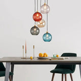 Lámpara colgante de vidrio de colores esférica moderna regulable en altura para comedor