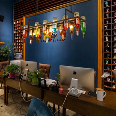 Lámpara colgante vintage con botellas de vidrio y altura regulable para comedor