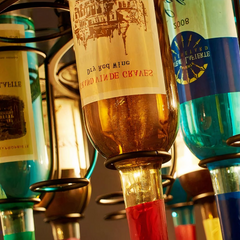 Lámpara colgante vintage con botellas de vidrio y altura regulable para comedor