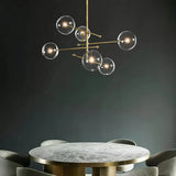 Lámpara colgante de vidrio moderna Magic Bean en dorado para comedor