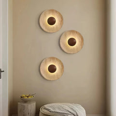 Aplique de pared de travertino redondo Wabi-Sabi Ø25 cm para dormitorio