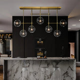 Lámpara colgante de vidrio moderna Magic Bean en dorado para comedor