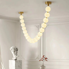 Lámpara colgante moderna y elegante con cadena de bolas blanca para salón