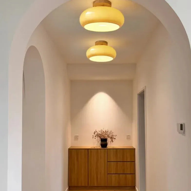 Elliptical Glass Corridor with Recessed Ceiling Lights