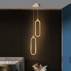 Lámpara colgante ovalada LED dorada minimalista para mesita de noche