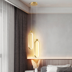 Lámpara colgante ovalada LED dorada minimalista para mesita de noche