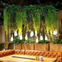 Lámparas colgantes comedor diseño con decoración de plantas